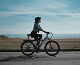 A woman riding on a bicycle